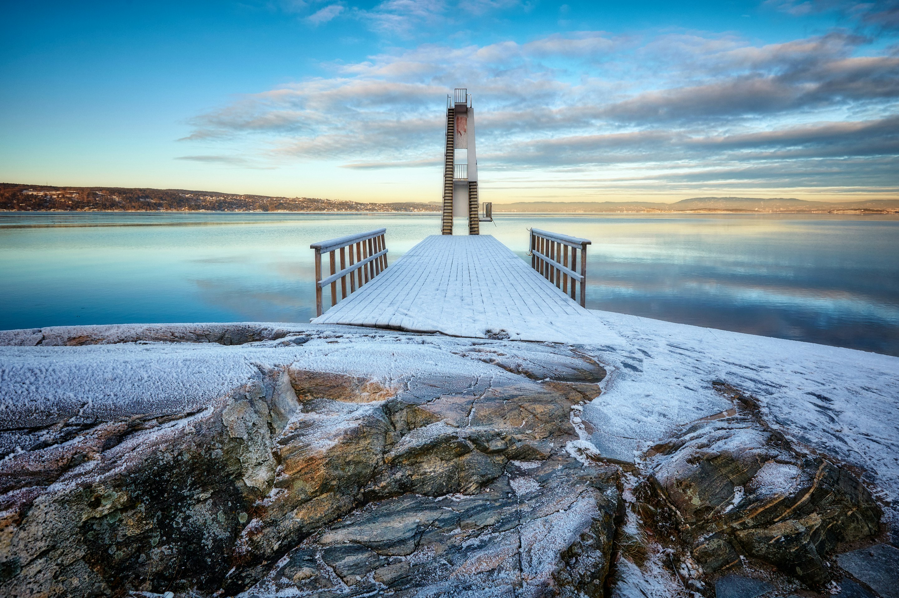 brown wooden dock near body of water